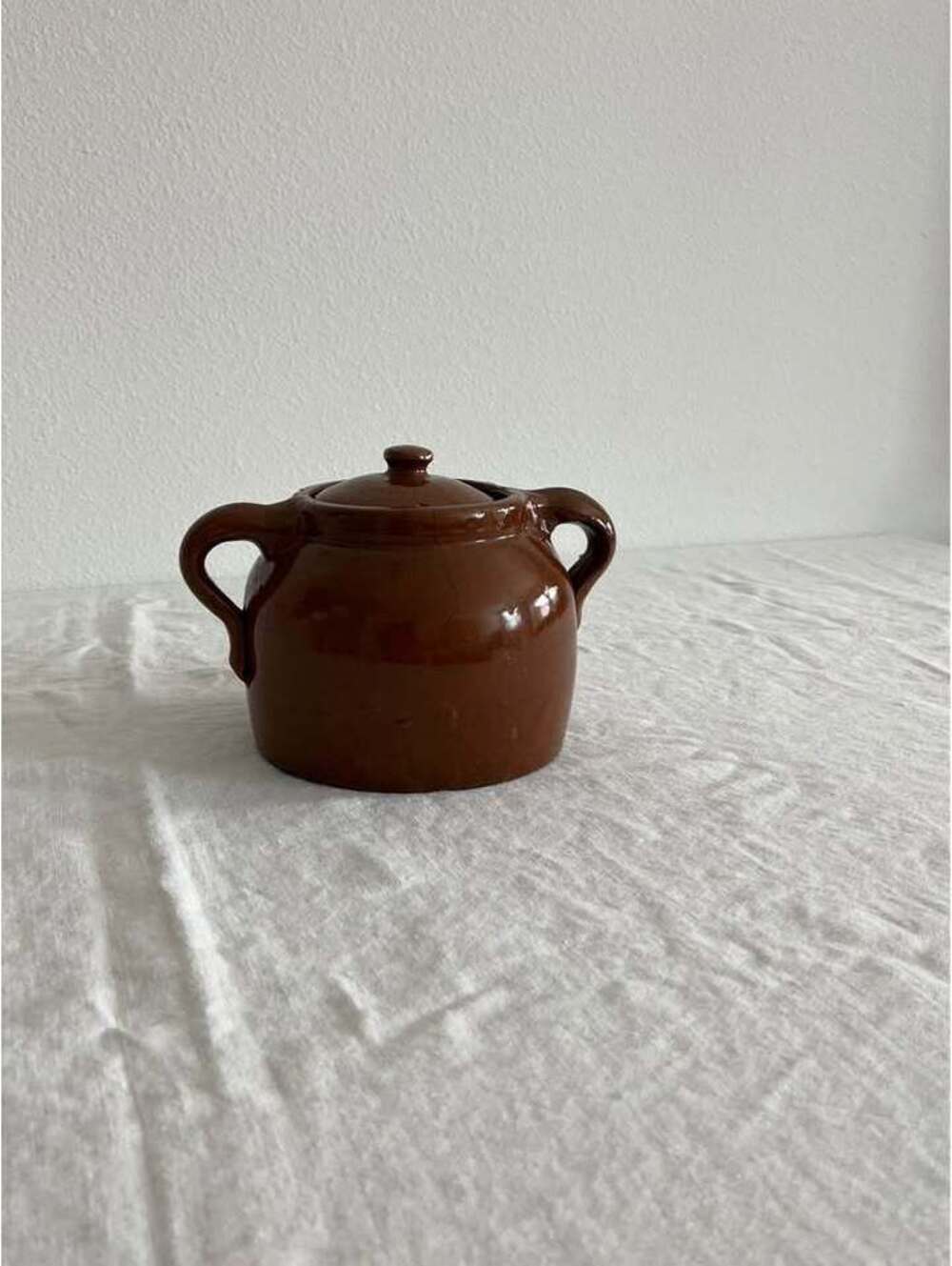 Vintage brown ceramic jar with lid